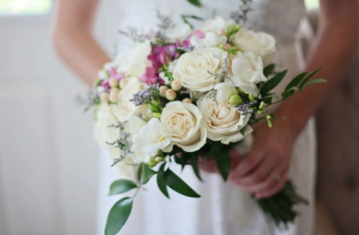 Bridal bouquet with white roses and greenery