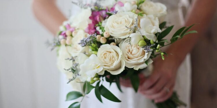 Bridal bouquet with white roses and greenery