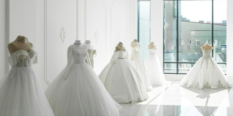 various wedding dresses in a boutique