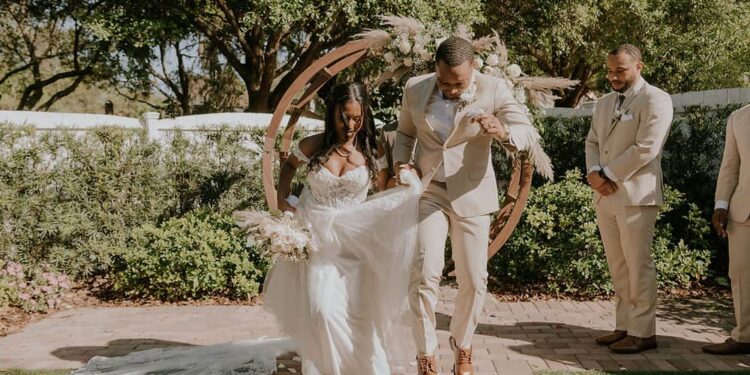 The bride and groom under the altar