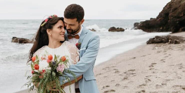 Bride and Groom Having Beach Wedding