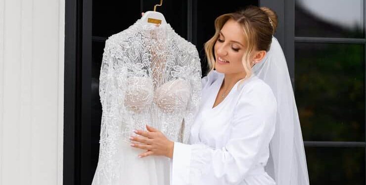 Bride Holding Her Wedding Dress
